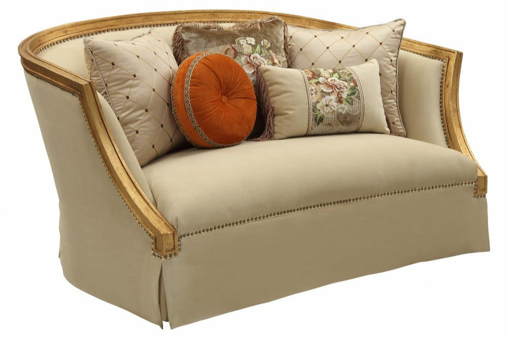 Geneviève 70" Tan Curved Loveseat with Gold Trim and Toss Pillows