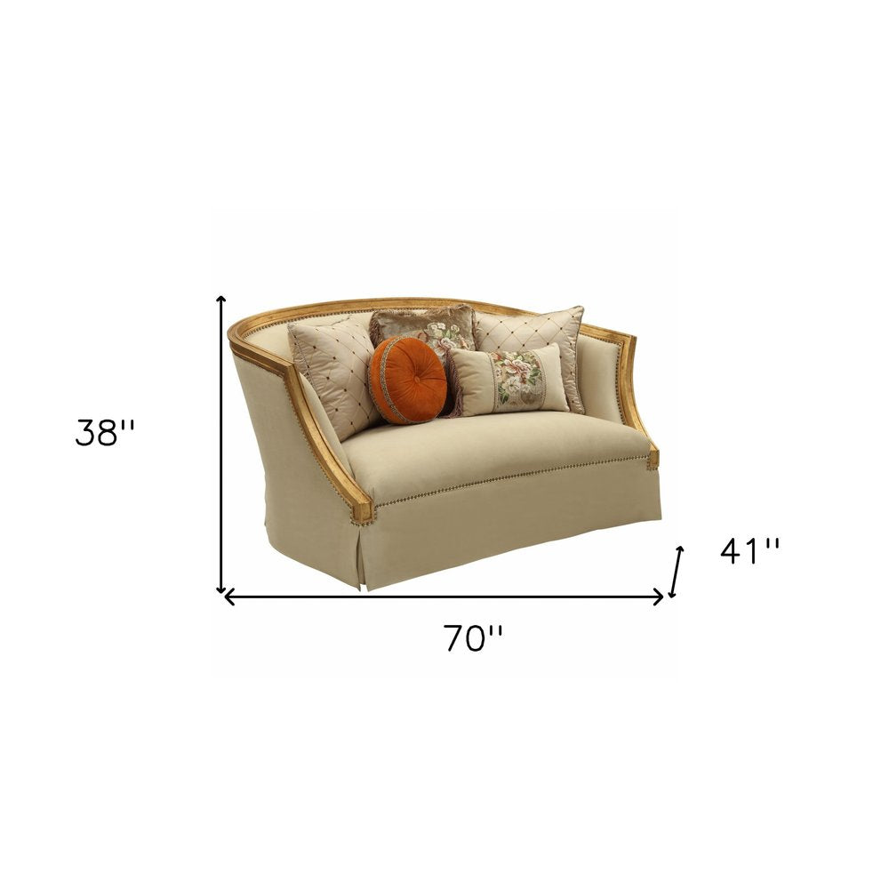 Geneviève 70" Tan Curved Loveseat with Gold Trim and Toss Pillows
