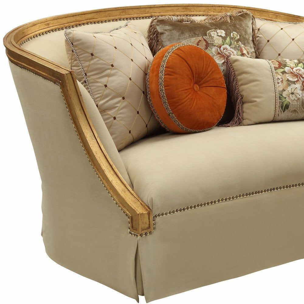 Geneviève 70" Tan Curved Loveseat with Gold Trim and Toss Pillows