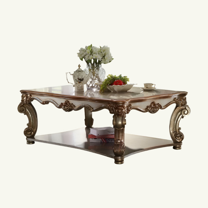 58-Inch Gold Wood Coffee Table with Shelf and Ornate Detailing