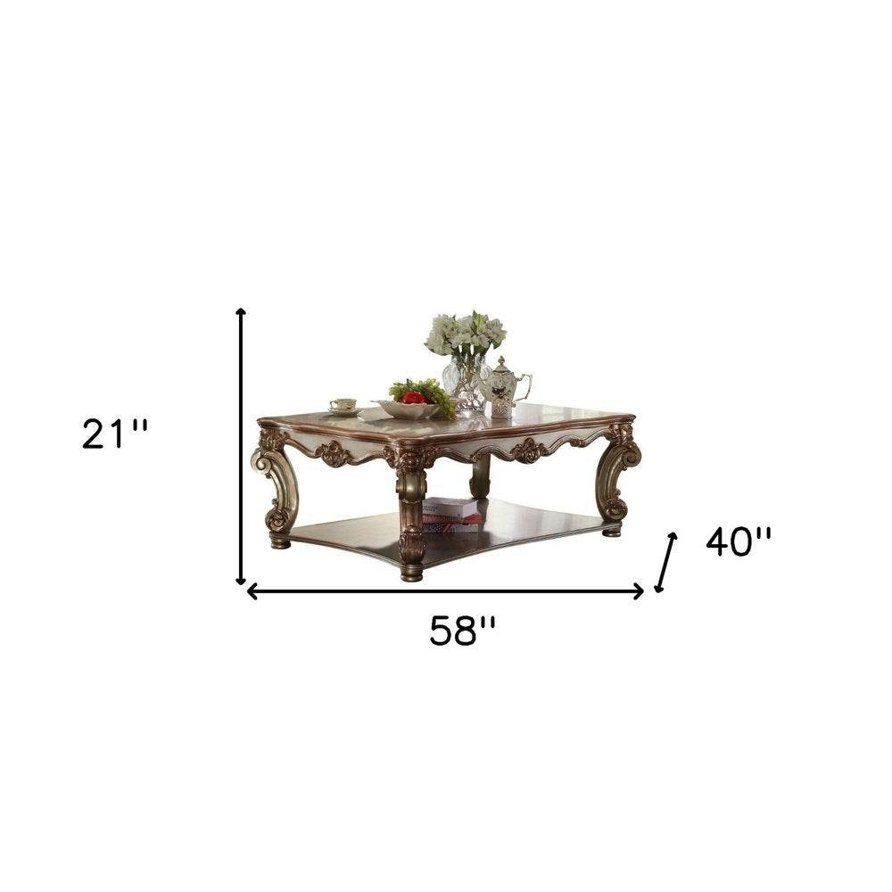58-Inch Gold Wood Coffee Table with Shelf and Ornate Detailing