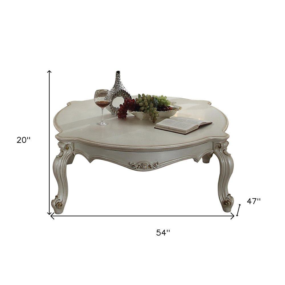 54-Inch Pearl Wood and Polyresin Coffee Table with Queen Anne Detailing