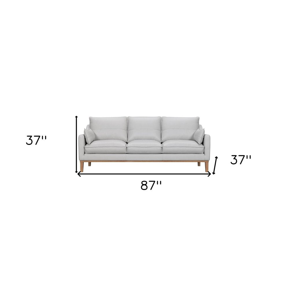 Marceau 87" Gray Leather Sofa with Brown Legs and Toss Pillows